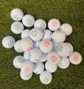 golf balls with 'Marfa Country Club' branding