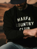 Model wearing the black Marfa Country Club Club Issue crewneck
