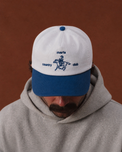 Model wearing the White and Liberty-blue Marfa Country Club Rider’s Cap