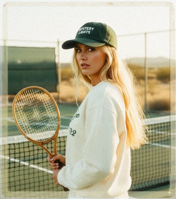  cap and white sweatshirt