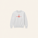 Light grey Rider crewneck on warm beige background with generous spacing