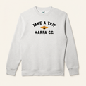 Light grey Take a Trip crewneck on warm beige background